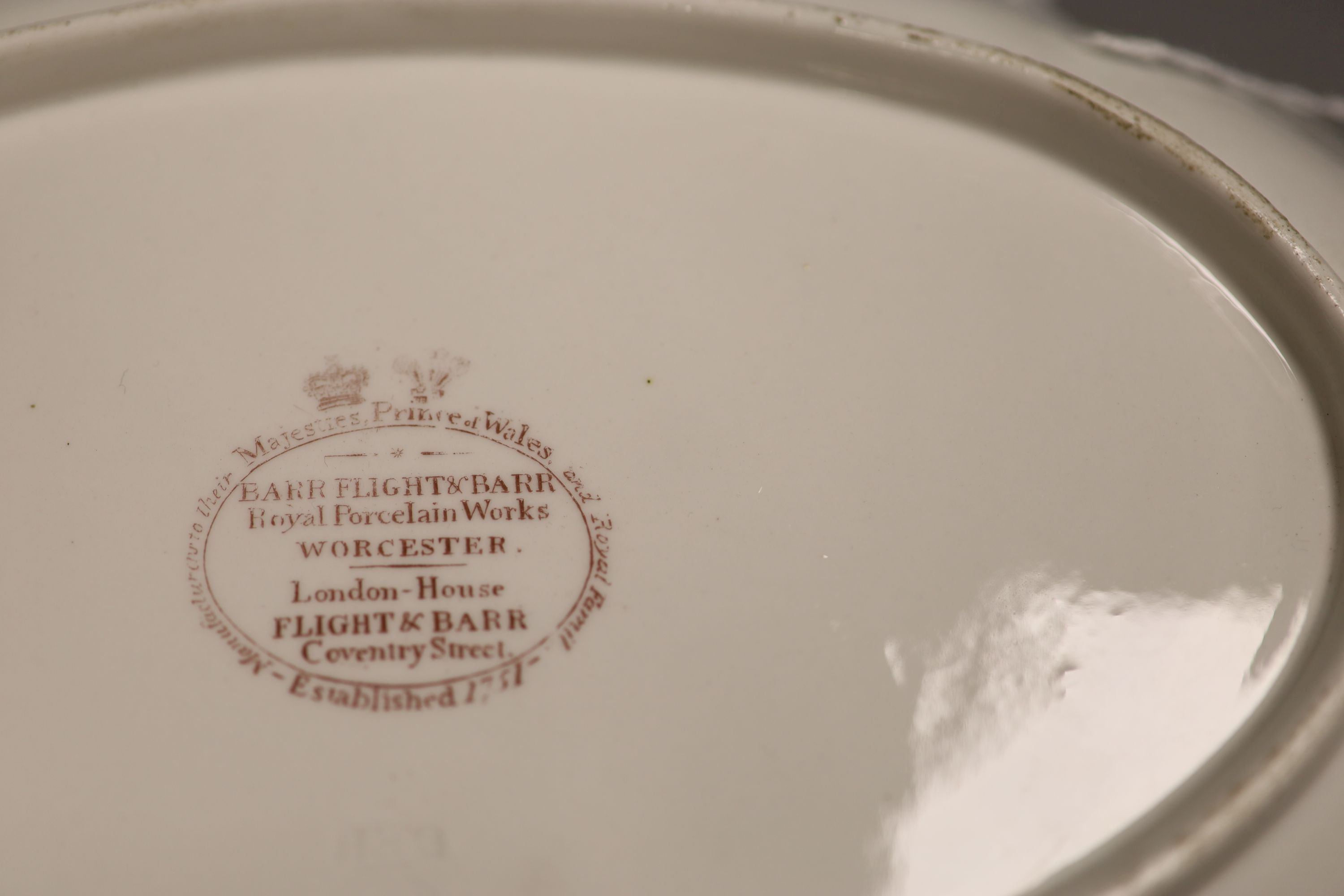 A Barr Flight and Barr pink ground oval dish with elaborate gilding and a family crest of a stag, Royal Warrant mark, c.1810, length 29